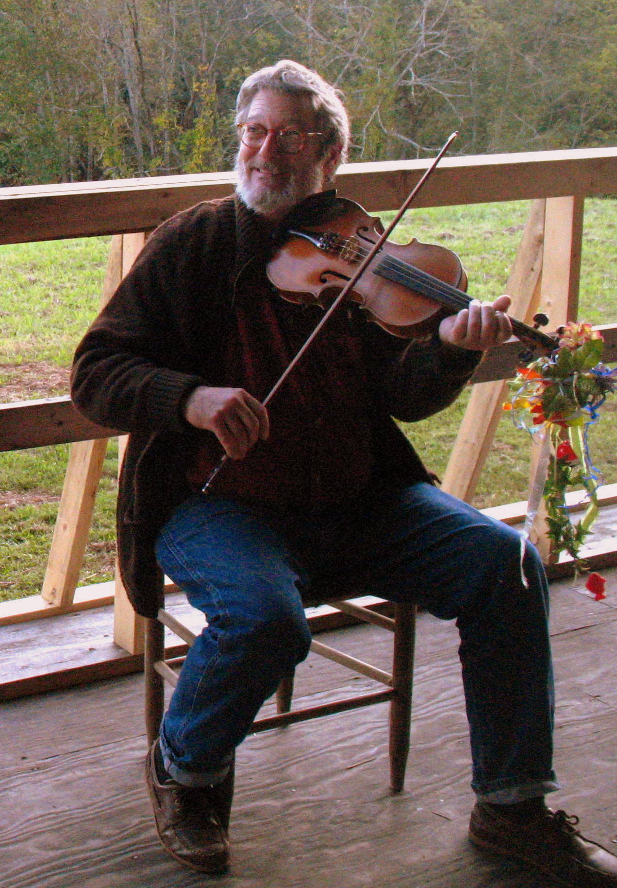 Director Jan Davidson playing fiddle