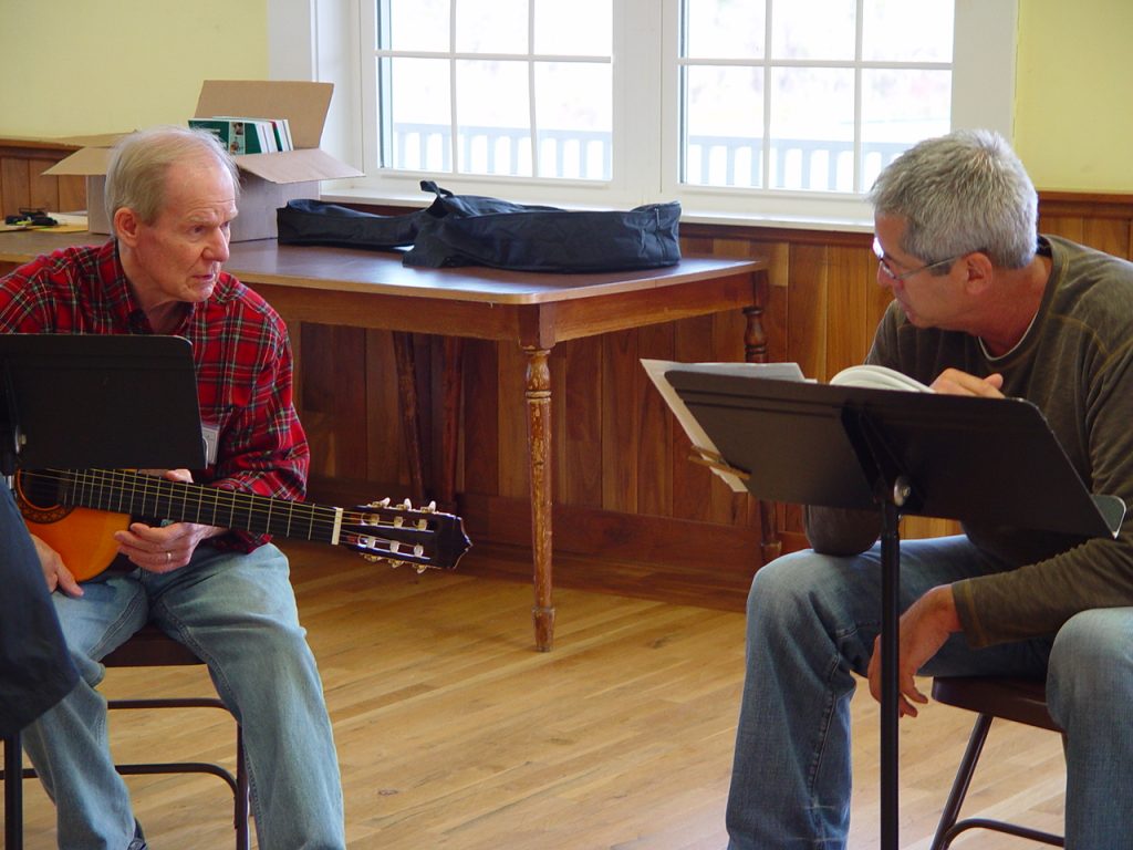 “What was I thinking?” passed through my mind several times last week while I sat in “Intro Guitar” class at the Folk School. In other studios, I imagined, students happily wove Shaker rugs or rolled polymer clay into intricate beads. Why had I signed up for a music class? My left fingers hurt from pressing on the steel guitar strings, I couldn’t change from a G chord to a D chord fast enough, and I’d probably never get “Goodnight Irene” out of my head again.  ...