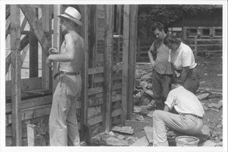 Georg Bidstrup (kneeling) observes progress