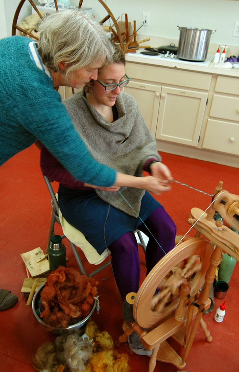 Martha shows Work/Study Bonnie a spinning technique