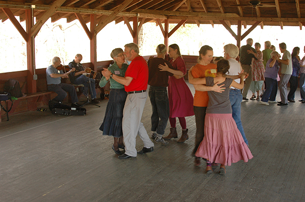 Jim's Irish Set Dancing class takes advantage of the nice weather and dances in Open House, our open air pavilion, by the garden. 