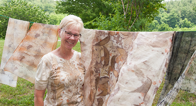 Kathy Hays displays her eco print creations outside the Wet Room.