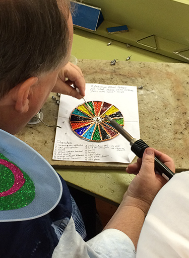 David works on a kaleidoscope project in the Jewelry Studio.