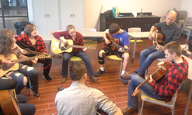On Friday, April 8, high school students in the Folk School JAM Program played a concert in the Community Room to celebrate the conclusion of the first session. Under the direction of Johnny Scroggs (guitar) and Peggy Patrick (fiddle), students spent 12 weeks learning traditional Appalachian music as part of the Folk School JAM program. We recently sat down with Program Director Hannah Levin to find out more about this wonderful program preserving traditional Appalachian music in our local high schools. Read on to find out how you (or your teen) can get involved!  ...