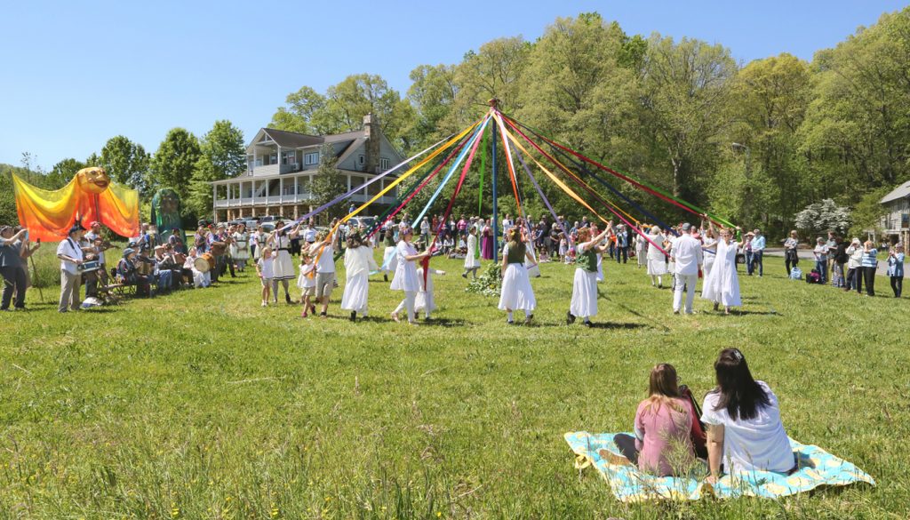 Wishing you a happy May Day! We're looking forward to dancing around the May Pole together again, but until then, we put together this post filled with photos of years past, a video from 2011, and an excerpt by Nanette Davidson about May Day from The Folk School Cookbook. Enjoy!