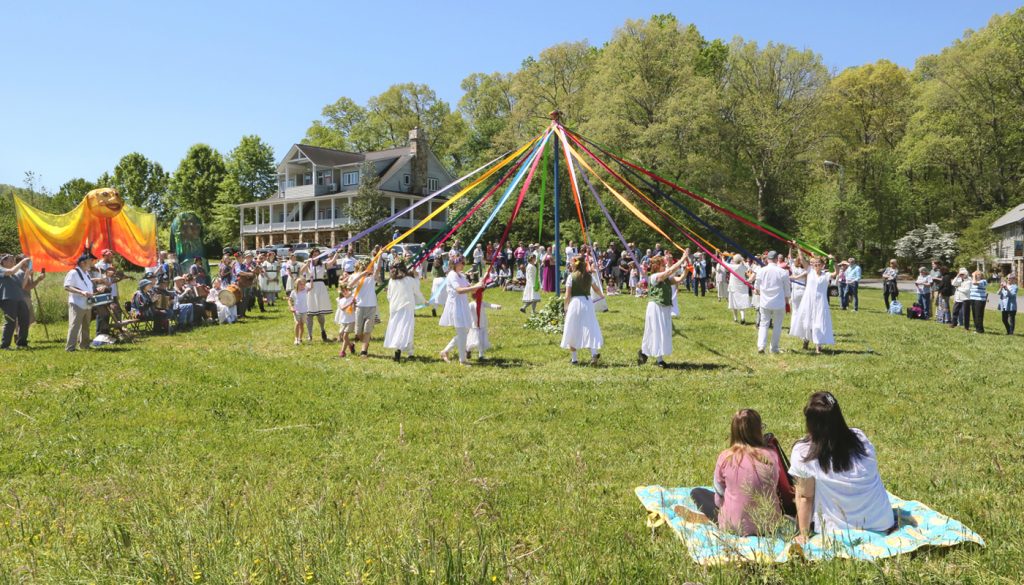 Wishing you a happy May Day! We're looking forward to dancing around the May Pole together again, but until then, we put together this post filled with photos of years past, a video from 2011, and an excerpt by Nanette Davidson about May Day from The Folk School Cookbook. Enjoy!