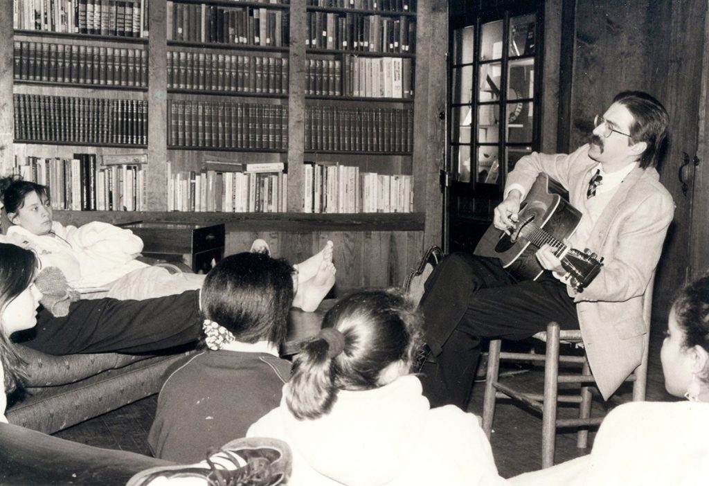 David playing music to youth in the Library