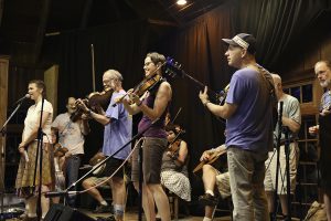 Playing fiddle on the Community Room stage during Dance Musicians Week