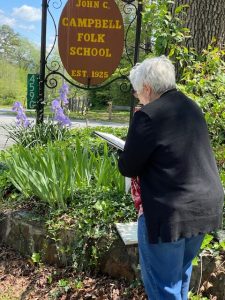 Pattie drawing a flower at the main entrance