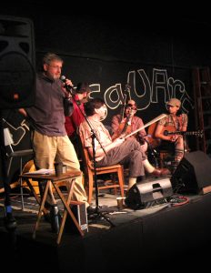 Bob Dalsemer calls a dance while Charmaine Slaven plays music