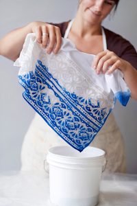 Jessica dipping a cloth in dye