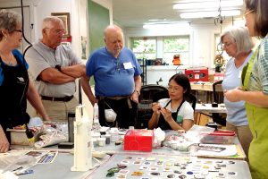 Charity Hall leading a jewelry lesson in the studio