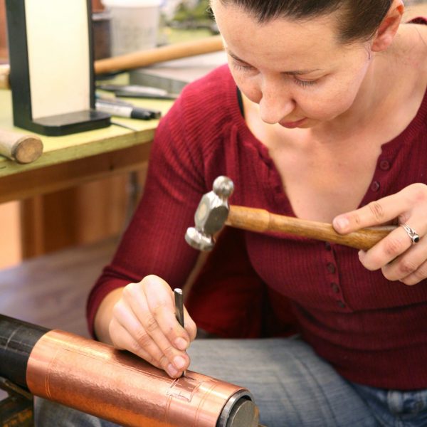 Hammering a copper piece