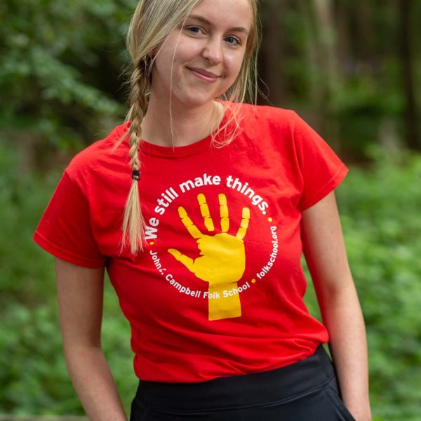 Young woman wearing a Folk School t-shirt