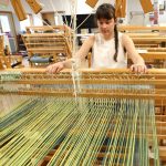 Mentorship student at the loom