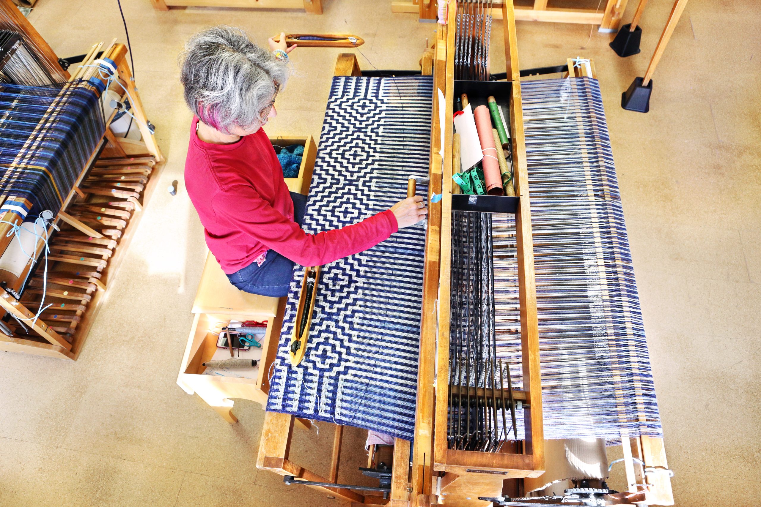 A student weaving