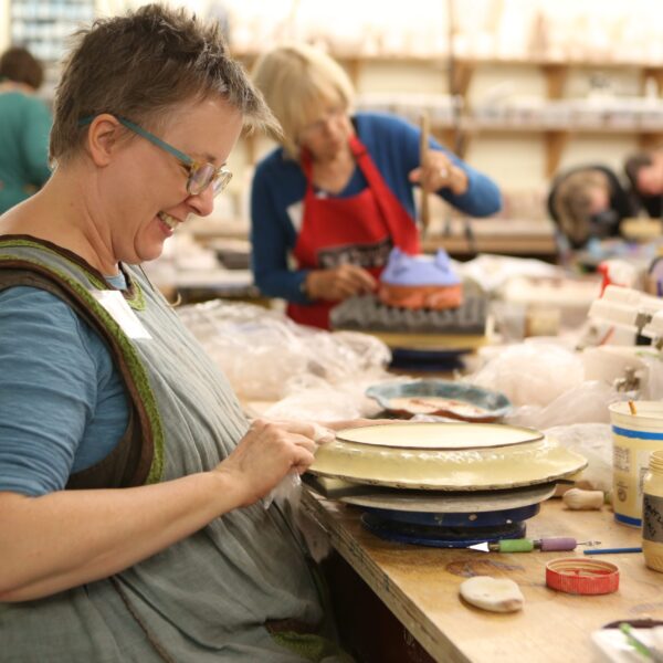 Putting final touches on a clay piece