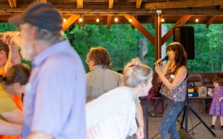 A group of people dancing in Open House