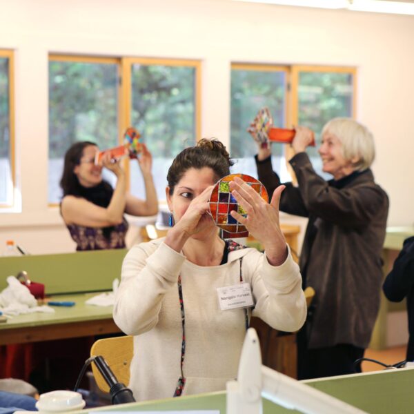 Students looking through their kaleidoscopes