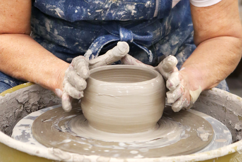 Clay pot on the pottery wheel