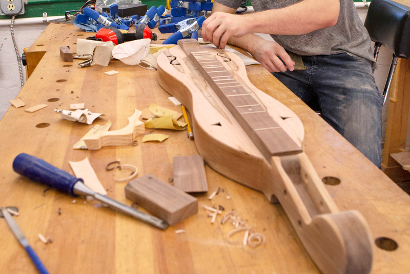 Man building a dulcimer