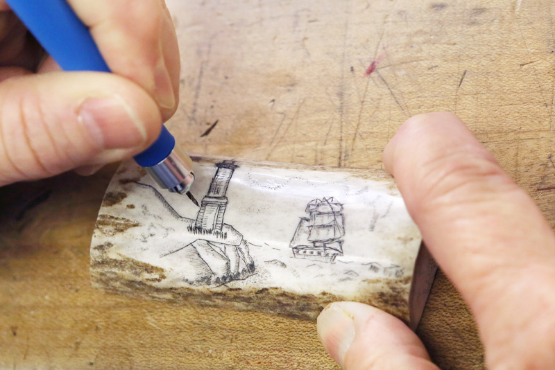 Image of Lighthouse carving into bone