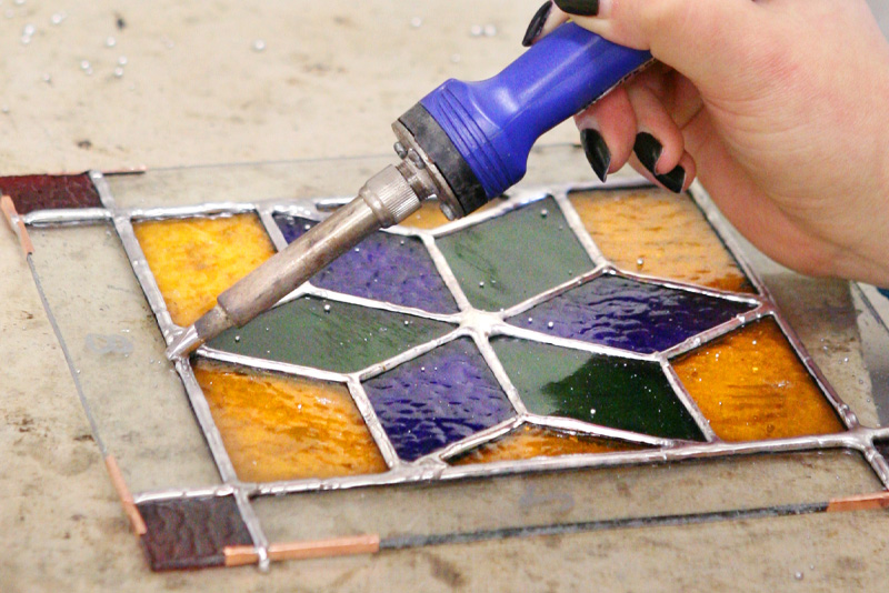 Image of soldering stained glass