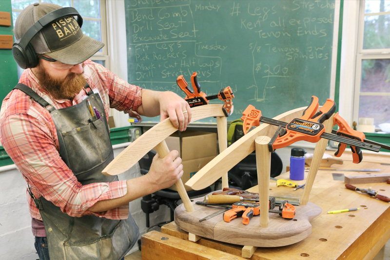 Image of a man building a chair