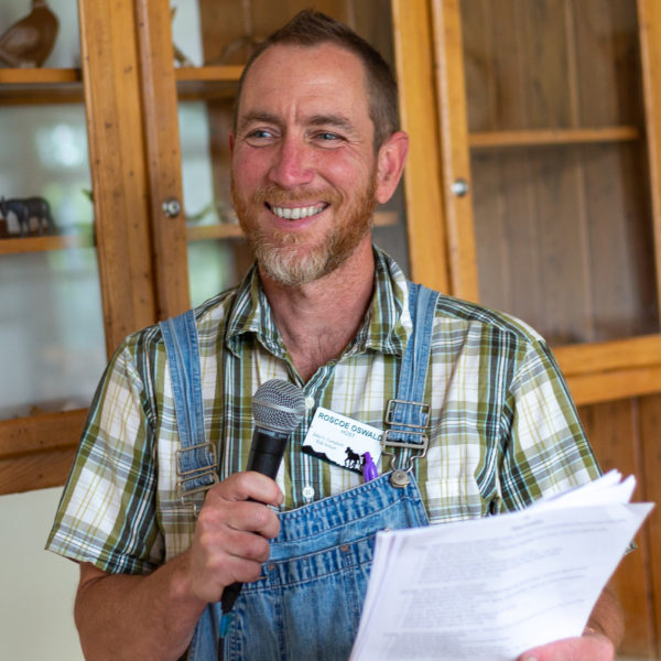 A student host making announcements at mealtime