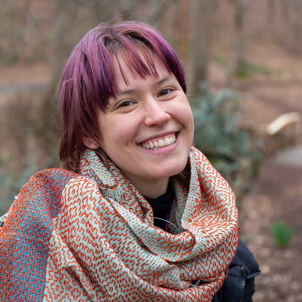 Work Study Lisa Eckenrode with her handwoven scarf