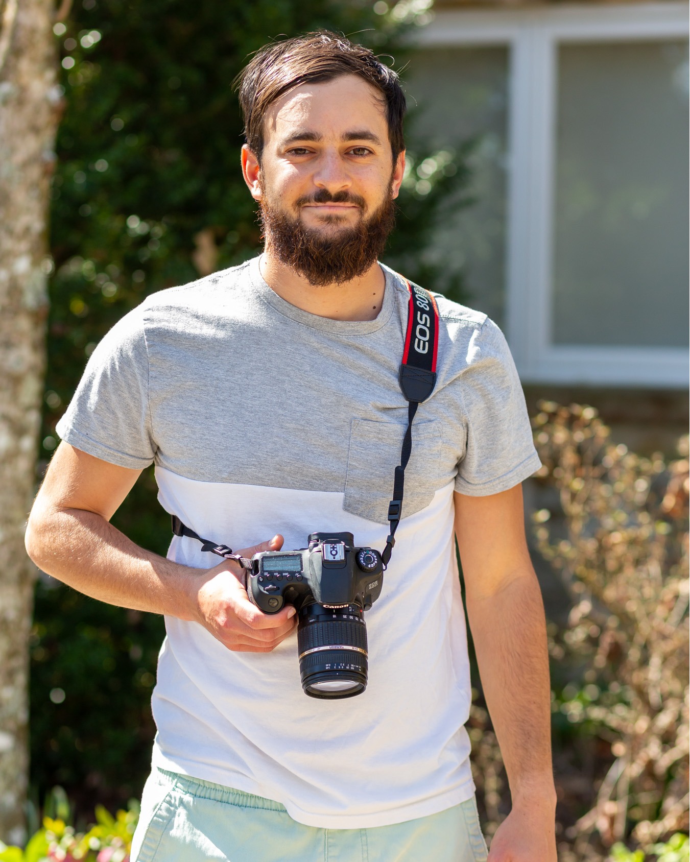 Work Study Joe Kuttler stands with his camera