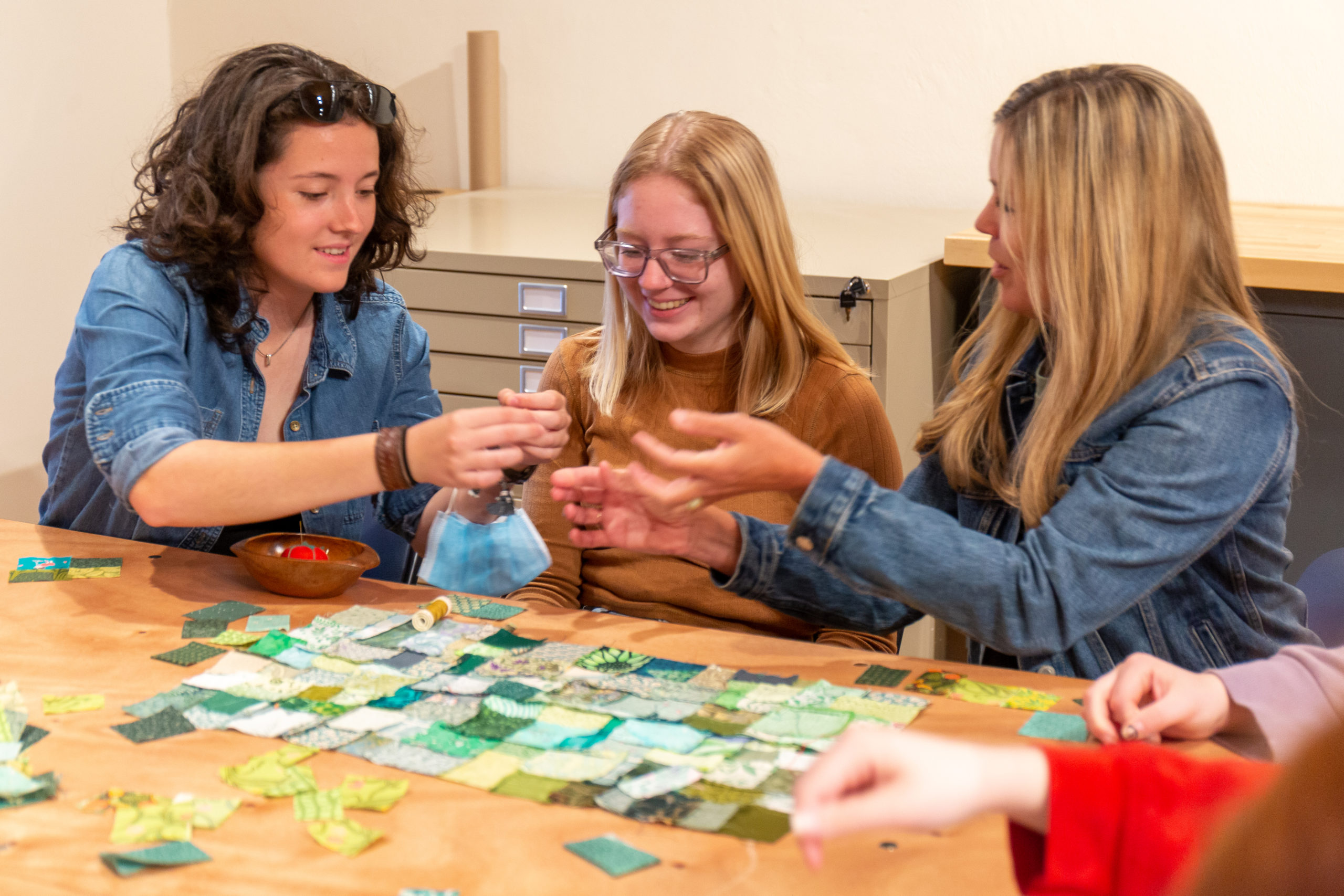 Tri-County students and their teacher enjoying a quilting workshop at Olive's Porch