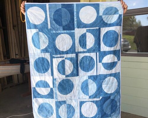 IMG_7482 An indigo-dyed blanket with a circle design on display