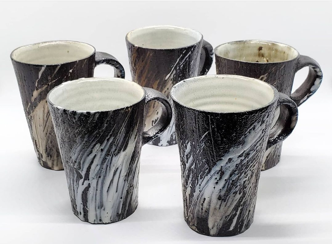 Black and white soda fired mugs
