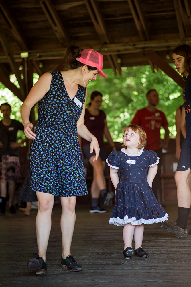 Becky Hill teaches clogging to a young dancer.