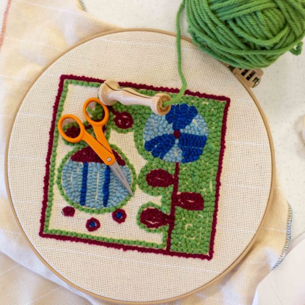 A floral punched needle rug hooking design