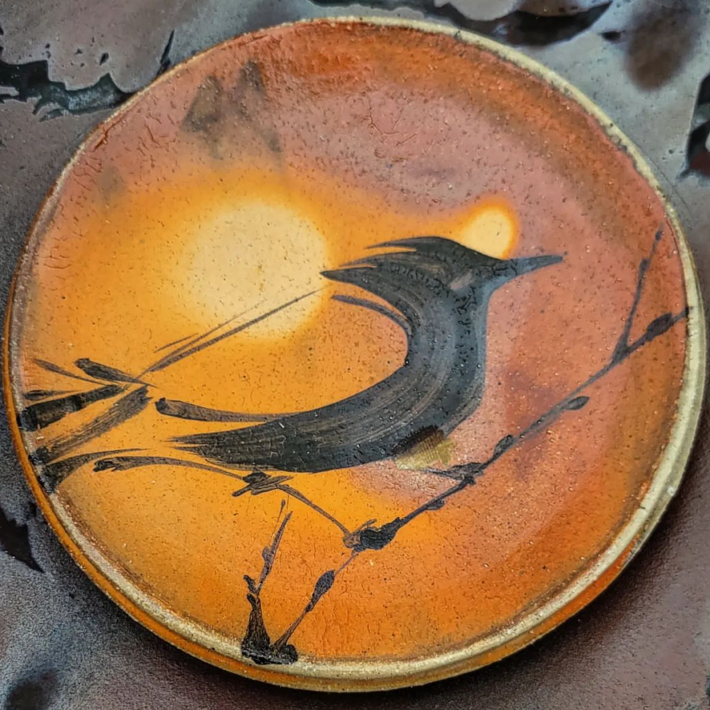 Tatoonie Bird on a clay plate