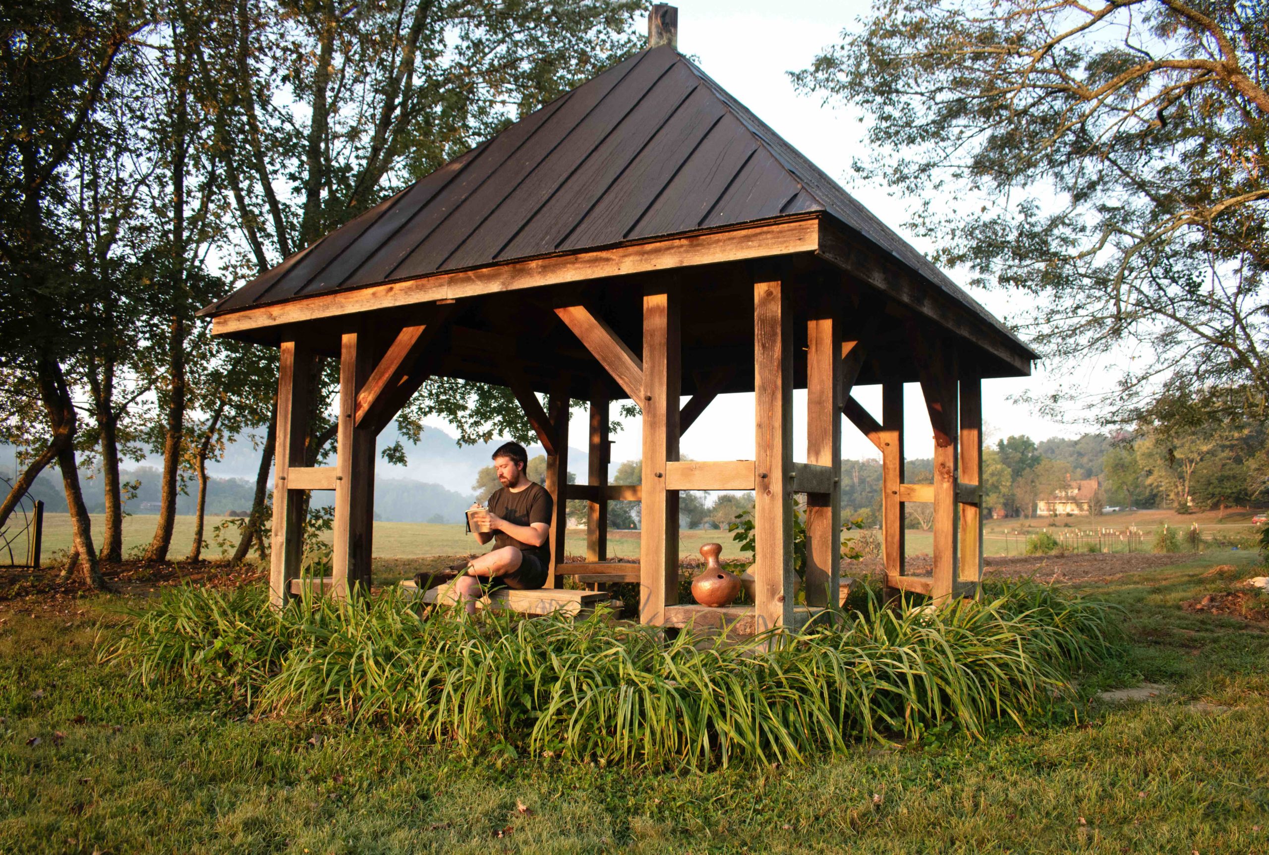 Robert writing in the John Neil Davidson Rhythm Pavilion