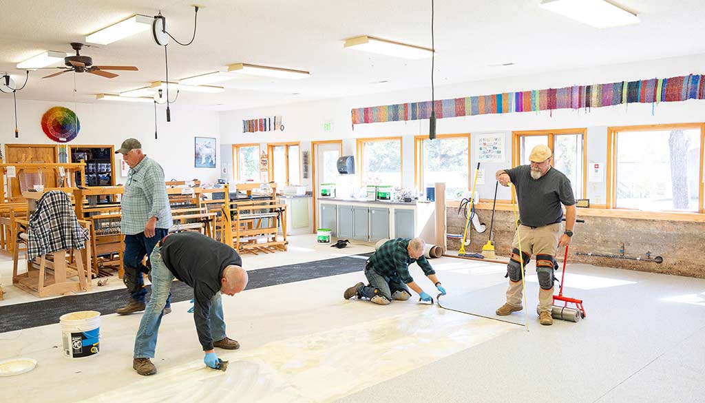 Ground crew replacing weaving floor.