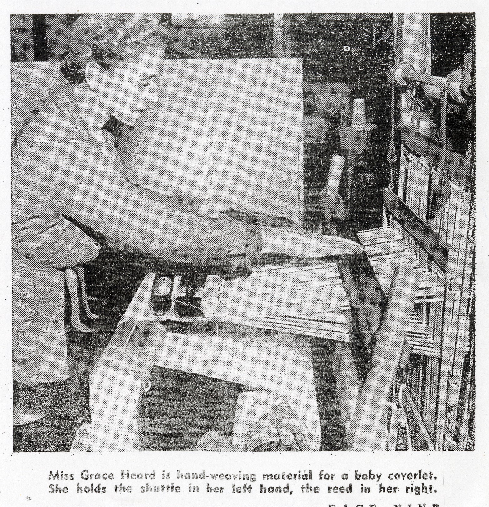 Hogan03 newspaper photo of a woman working on a loom, captioned "Miss Grace Heard is hand-weaving material for a baby coverlet. She holds the shuttle in her left hand, the reed in her right."