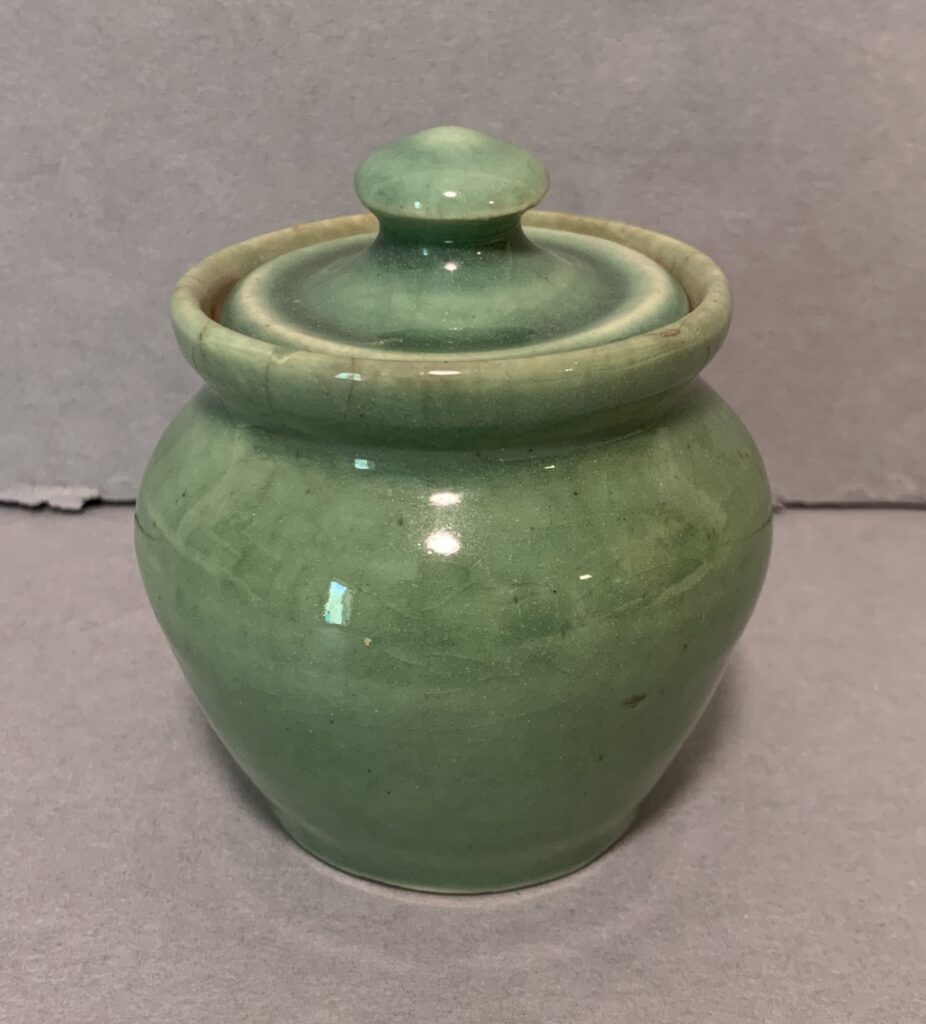 round, green glazed jar with lid