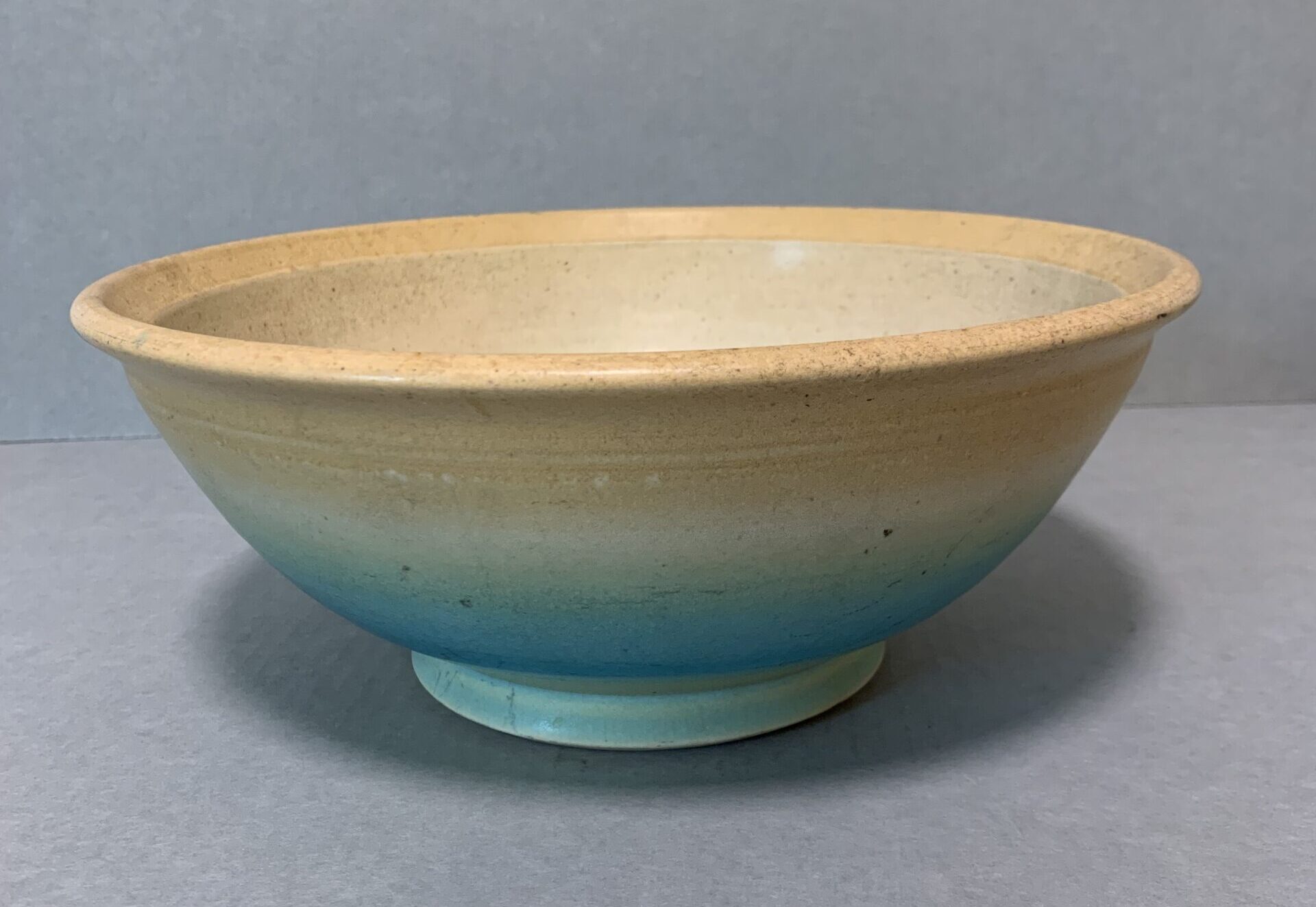 large ceramic bowl with gradient blue and yellow color